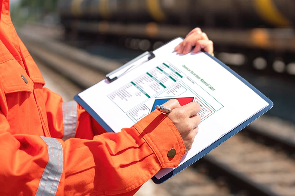 man reviewing hazmat clipboard