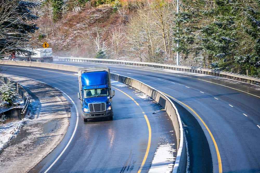 truck on curving winter road