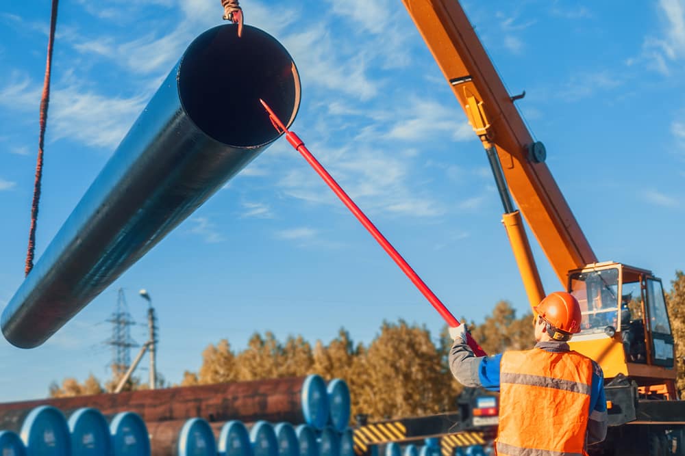 moving large pipe with special equipment