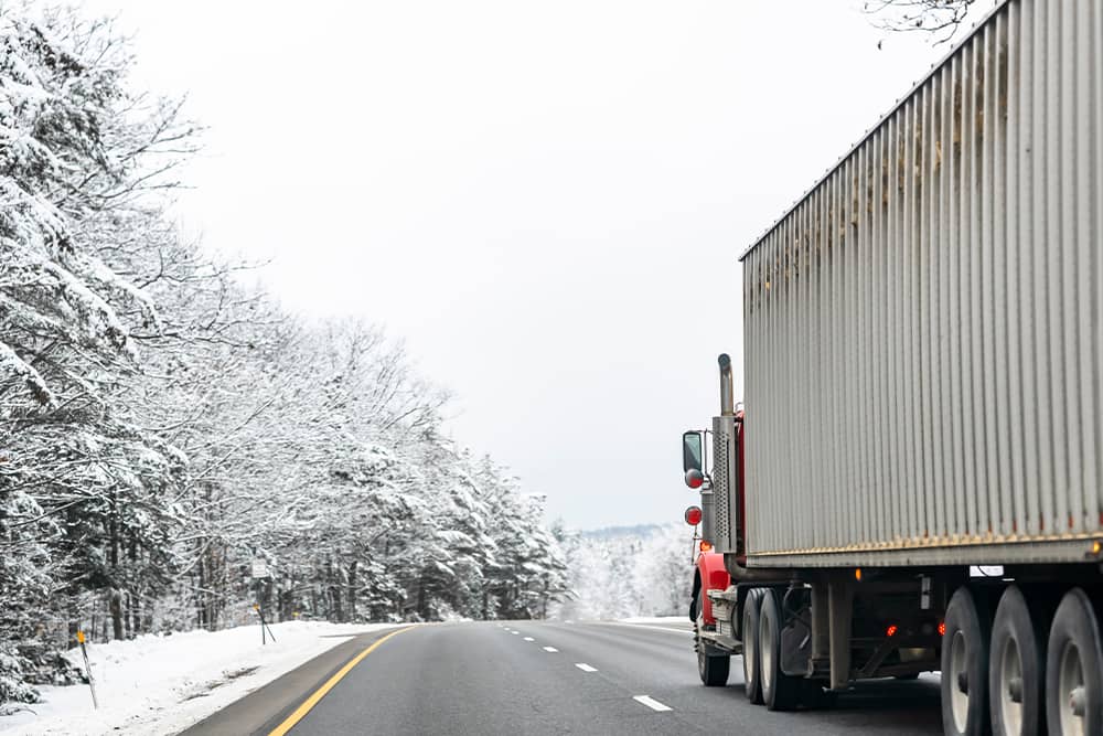 trucking driving through freezing cold
